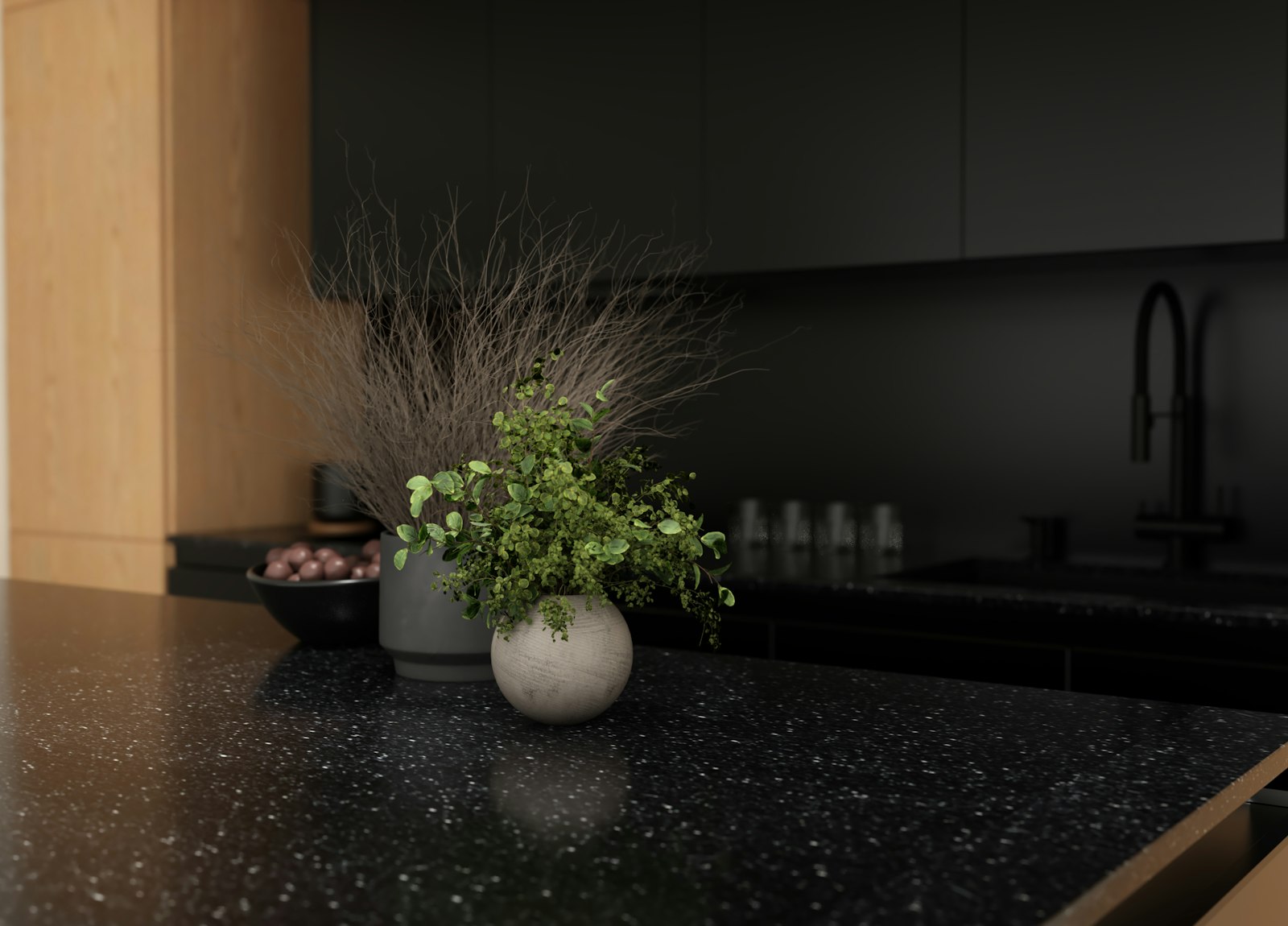 Black stone worktop against oak cabinetry