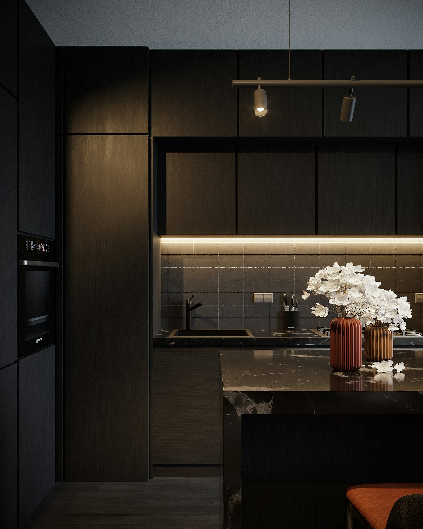 Dark kitchen with warm under-cabinet lighting