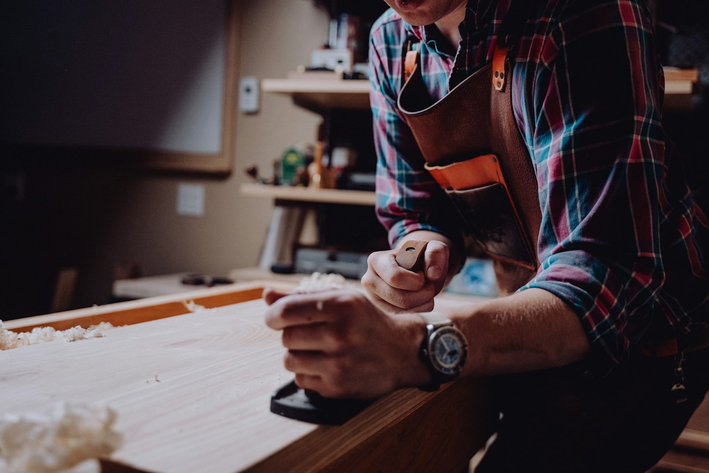 Craftsman planing a board